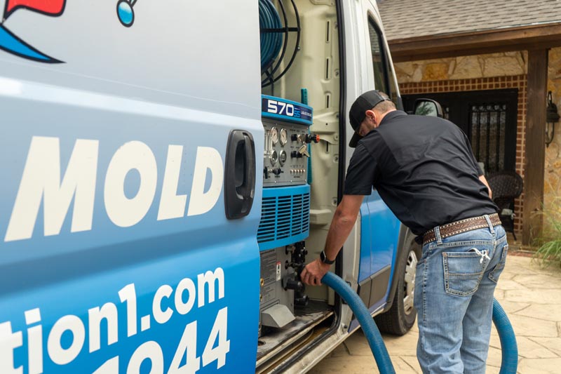 technician hooking up hoses