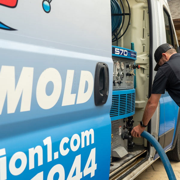 technician hooking up hoses