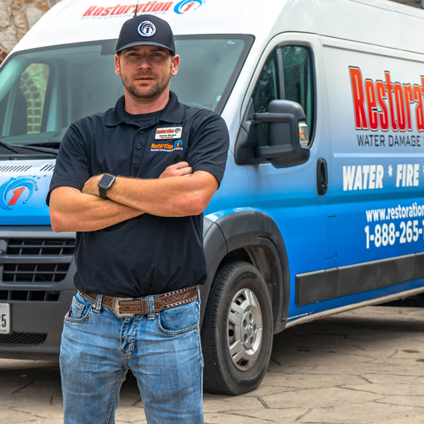 technician standing in front of van